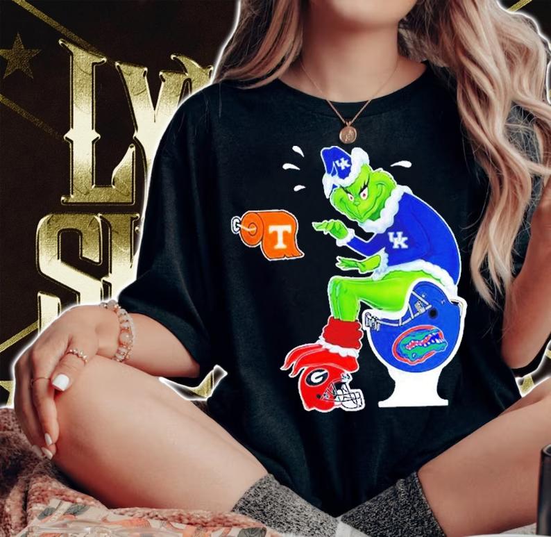 The Grinch Kentucky Wildcats Sitting On Florida Gators And Other Teams Christmas Shirt t-shirt woman shirt